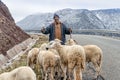 Berber shepherd with his flock in remote High Atlas mountain Royalty Free Stock Photo