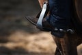 Close-up of Booted Foot in a Stirrup