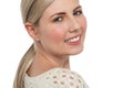 Tight face closeup of smiling teen blonde girl Royalty Free Stock Photo