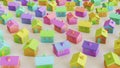 Variously Colored Toy Wooden Houses in a Tight Even Grid on a Simple Concrete Surface