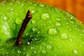 Tight Macro of a Green Apple top covered in water drops near the Royalty Free Stock Photo