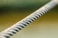 Tight steel cable on blury background Royalty Free Stock Photo