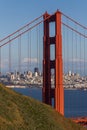 A vertical crop of the North Tower of the Golden Gate Bridge with the afternoon sun shining on San Francisco in the background Royalty Free Stock Photo