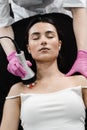 Tightening and rejuvenation of girl skin at cosmetology procedure. Thermal or radio frequency hardware RF lifting for Royalty Free Stock Photo