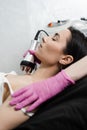 Tightening and rejuvenation of girl skin at cosmetology procedure. Thermal or radio frequency hardware RF lifting for Royalty Free Stock Photo