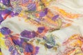 The Tighting white silk fabric with multi-colored prints