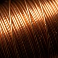 Tightly coiled copper wire, characterized by its distinctive warm, reddish hue and Royalty Free Stock Photo