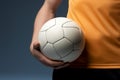 A tightly held ball is the focus of a close up shot