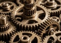 Tightly packed brass gears interlock in a dense arrangement, showcasing mechanical precision and Royalty Free Stock Photo