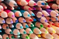 Tightly packed crayons in a stack. Colored tips close up Royalty Free Stock Photo