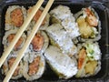 Tightly packed sushi rolls on platter Royalty Free Stock Photo