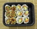 Tightly packed sushi rolls on platter