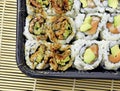 Tightly packed sushi rolls on platter Royalty Free Stock Photo