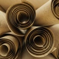 Tightly rolled sheets of parchment create a cylindrical pattern, intertwining in a Royalty Free Stock Photo