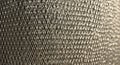 Tightly woven metallic mesh with a grid pattern, featuring interlocking diamond Royalty Free Stock Photo