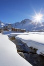 Tignes village with sun and creek