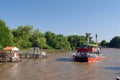 Tigre, Argentina - Tourist passes or cruise ships docked in the port of Tigre, in the Parana delta