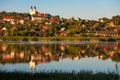 Tihany village and the abbey in warm sunset colors with the inner lake in the front and a beautiful refletion on water Royalty Free Stock Photo