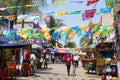 People Shop Beneath Hanging Flags in Tijuana, Mexico Royalty Free Stock Photo