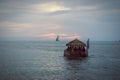 Tiki Bar Boat at Sunset Floating on the Atlantic Ocean