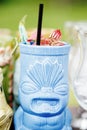 Tiki beach cocktail with orchid flower