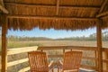 tiki hut and chairs in swamp Royalty Free Stock Photo