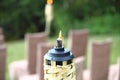 tiki torches and chairs set up for a wedding Royalty Free Stock Photo