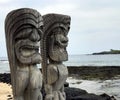 Tikis standing on the beach