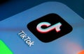 TikTok app on the smartphone screen with visible pixels. Selective focus. Macro