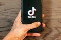 TikTok application icon on Apple iPhone 11 screen close-up. Royalty Free Stock Photo