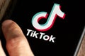 TikTok application icon on Apple iPhone 11 screen close-up. Royalty Free Stock Photo