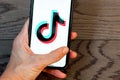 TikTok application icon on Apple iPhone 11 screen close-up. Royalty Free Stock Photo