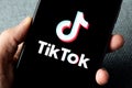 TikTok application icon on Apple iPhone 11 screen close-up. Royalty Free Stock Photo