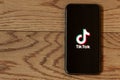 TikTok application icon on Apple iPhone 11 screen close-up. Royalty Free Stock Photo