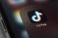 TikTok icon mobile app on screen smartphone