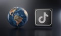 TikTok Logo Beside Earth 3D Rendering. Top Apps Concept