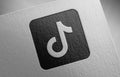 Tiktok-share-icon-black-1_1 on paper texture Royalty Free Stock Photo