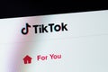 TikTok website on display notebook closeup