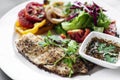 Tilapia fish fillet with mixed salad and grilled vegetables Royalty Free Stock Photo