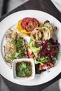 Tilapia fish fillet with mixed salad and grilled vegetables Royalty Free Stock Photo