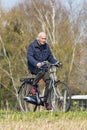 Cycling male senior enjoys the spring weather, Brabant, Netherlands Royalty Free Stock Photo