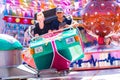 Tilburg, Netherlands - 2207.2019: people having a ride on break dance carousel in luna park, funfair called Kermis in Tilburg