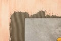 Tile and adhesive mix on wall, closeup Royalty Free Stock Photo