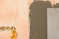 Tile and adhesive mix on wall, closeup Royalty Free Stock Photo