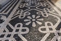 Tile brick floor in Lisbon, Portugal. Traditional old type mosaic on the sidewalk or pavement in the city Royalty Free Stock Photo