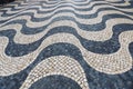 Tile brick floor in Lisbon, Portugal. Traditional old type mosaic on the sidewalk Royalty Free Stock Photo