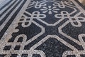 Tile brick floor in Lisbon, Portugal. Traditional old type mosaic on the sidewalk Royalty Free Stock Photo