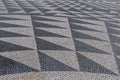 Tile brick floor in Lisbon, Portugal. Traditional old type mosaic on the sidewalk Royalty Free Stock Photo