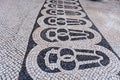 Tile brick floor in Lisbon, Portugal. Traditional old type mosaic on the sidewalk. Royalty Free Stock Photo