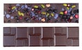 Tile of handmade homemade chocolate with pieces of dry fruit and